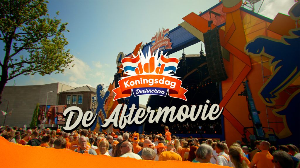Group of people in front of the final stage during King's Day in Doetinchem.  